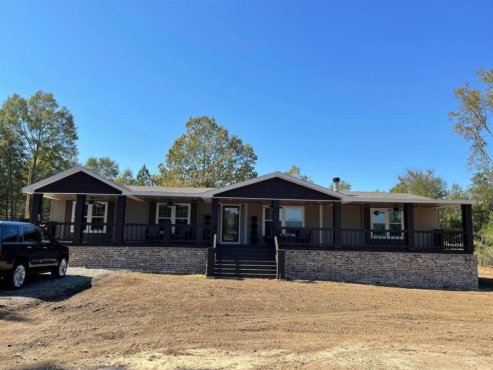 A standard double-wide used mobile home situated on a residential lot.