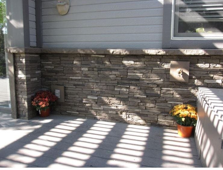 Decorative vinyl skirting installed around the base of a mobile home